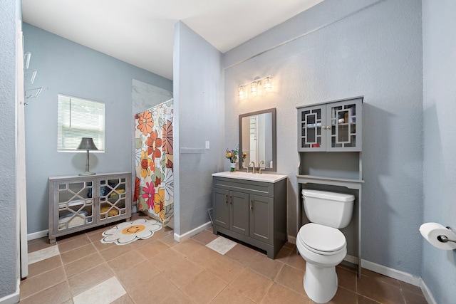3525 N Morning Glory Dr, Santa Fe, TX 77517 - full bathroom featuring vanity, toilet, a shower with shower curtain, and baseboards