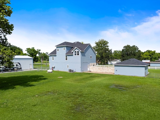 3525 N Morning Glory Dr, Santa Fe, TX 77517 - back of property featuring central AC