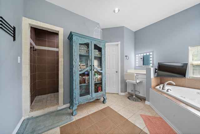 3525 N Morning Glory Dr, Santa Fe, TX 77517 - bathroom featuring a garden tub, tiled shower, tile patterned floors, and baseboards