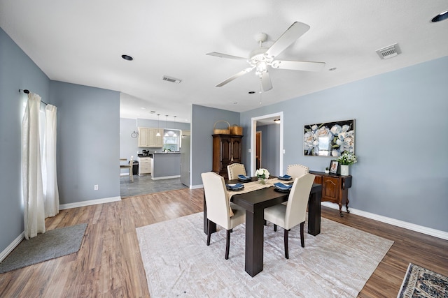 3525 N Morning Glory Dr, Santa Fe, TX 77517 - dining area featuring light wood-style floors, baseboards, and ceiling fan