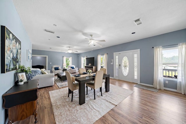 3525 N Morning Glory Dr, Santa Fe, TX 77517 - dining area featuring plenty of natural light, a textured ceiling, wood finished floors, ceiling fan, and baseboards