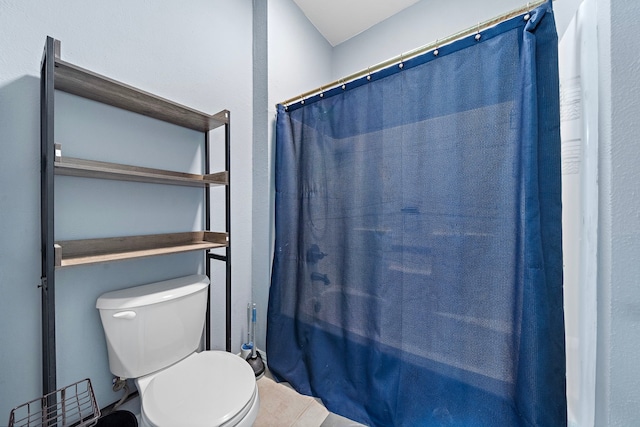 3525 N Morning Glory Dr, Santa Fe, TX 77517 - bathroom with toilet and a shower with shower curtain