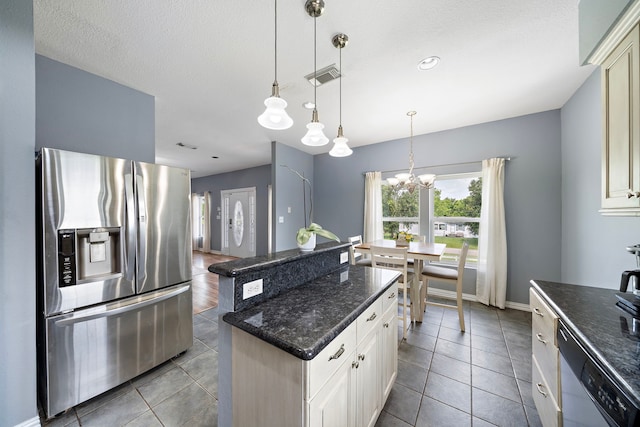 3525 N Morning Glory Dr, Santa Fe, TX 77517 - kitchen with stainless steel fridge with ice dispenser, dishwasher, tile patterned floors, a chandelier, and a center island