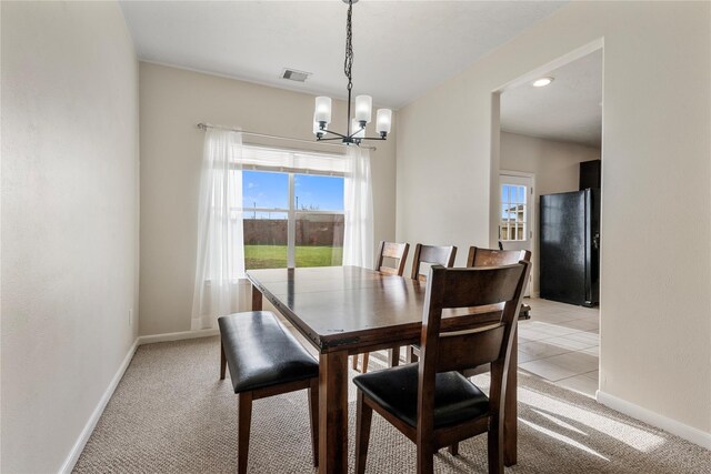 20507 Avery Grove Ct, Cypress, TX 77433 - dining room featuring baseboards, a chandelier, healthy amount of natural light, and light colored carpet