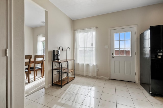 20507 Avery Grove Ct, Cypress, TX 77433 - doorway featuring light tile patterned floors and baseboards
