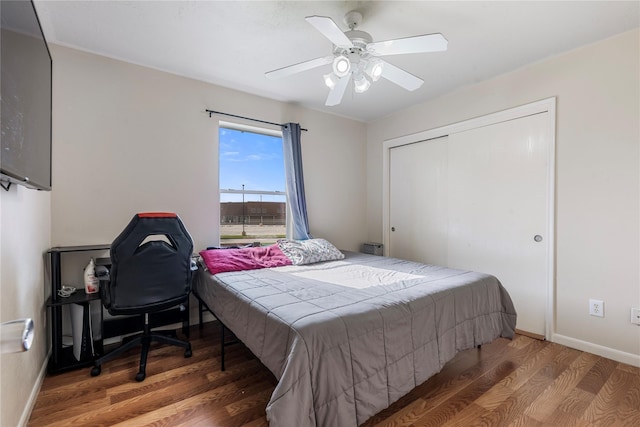 20507 Avery Grove Ct, Cypress, TX 77433 - bedroom with wood finished floors, a closet, a ceiling fan, and baseboards