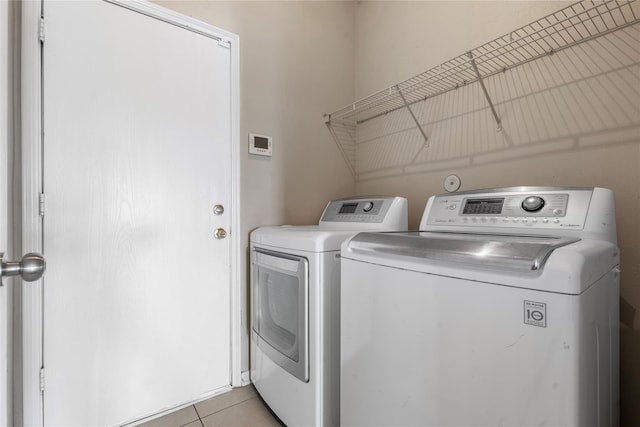 20507 Avery Grove Ct, Cypress, TX 77433 - washroom featuring washing machine and dryer and light tile patterned floors