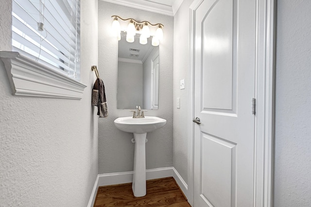 4402 Lillian St Unit 8, Houston, TX 77007 - bathroom featuring crown molding, wood finished floors, and baseboards