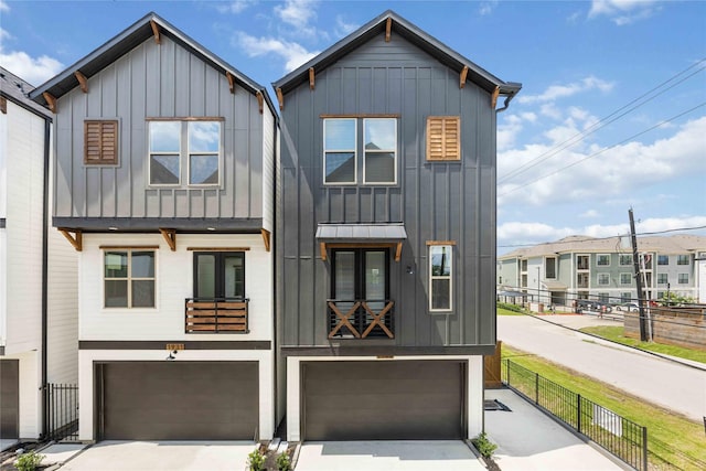 1941 Johanna Dr, Houston, TX 77055 - view of front of house featuring board and batten siding, a garage, and concrete driveway