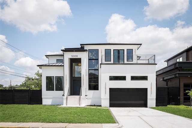 5008 Holt St, Bellaire, TX 77401 - modern home featuring a balcony, stucco siding, concrete driveway, an attached garage, and a standing seam roof