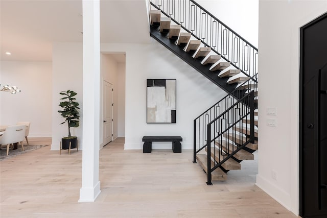 5008 Holt St, Bellaire, TX 77401 - foyer entrance featuring stairs, light wood-type flooring, baseboards, and recessed lighting