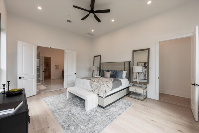 5008 Holt St, Bellaire, TX 77401 - bedroom with light wood finished floors, recessed lighting, and baseboards