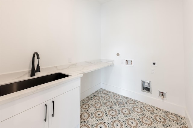 5008 Holt St, Bellaire, TX 77401 - laundry room with hookup for an electric dryer, hookup for a washing machine, cabinet space, and baseboards