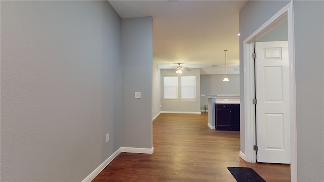2405 Dolly Wright St, Houston, TX 77088 - hallway featuring dark wood-type flooring and baseboards