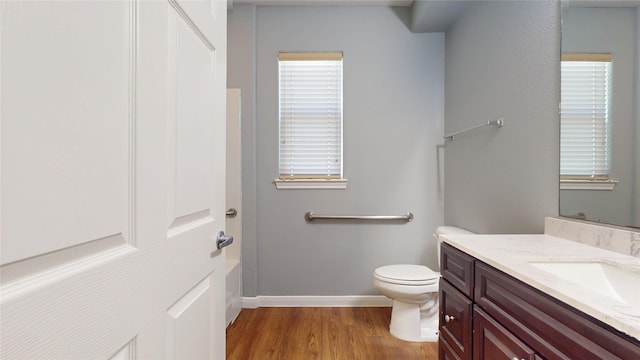 2405 Dolly Wright St, Houston, TX 77088 - full bath with vanity, baseboards, wood finished floors, toilet, and  shower combination