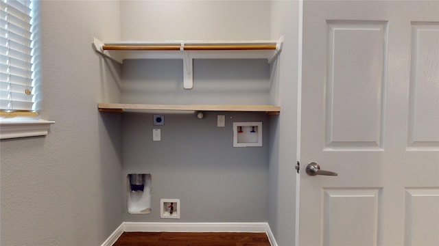 2405 Dolly Wright St, Houston, TX 77088 - laundry room with hookup for an electric dryer, gas dryer hookup, washer hookup, wood finished floors, and baseboards