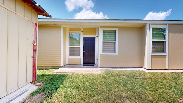 2405 Dolly Wright St, Houston, TX 77088 - doorway to property with a lawn