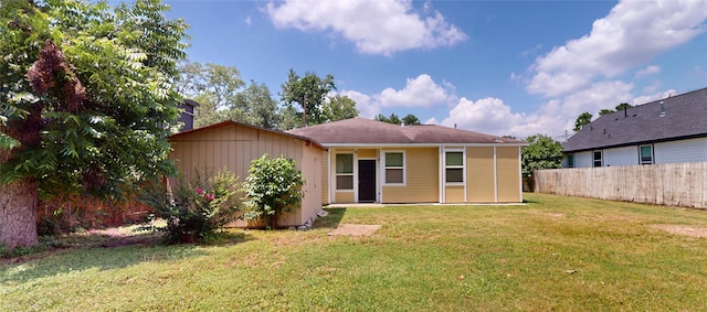 2405 Dolly Wright St, Houston, TX 77088 - rear view of property featuring board and batten siding