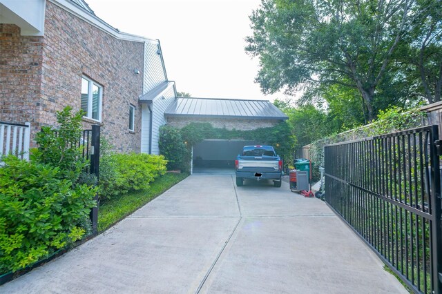 10614 Moonlight Dr, Houston, TX 77096 - view of side of property featuring a standing seam roof and metal roof