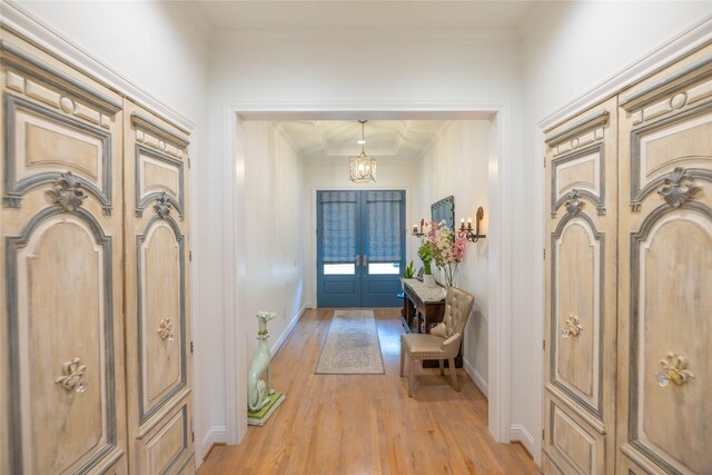 10614 Moonlight Dr, Houston, TX 77096 - entryway with light wood-style flooring, a chandelier, french doors, crown molding, and baseboards