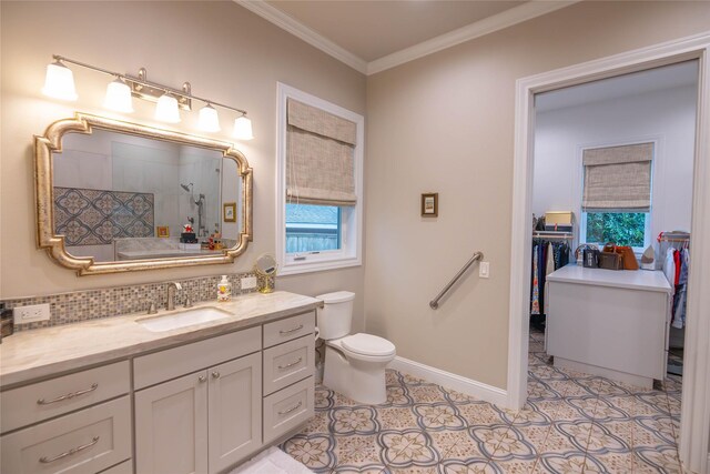 10614 Moonlight Dr, Houston, TX 77096 - full bathroom with vanity, toilet, a tile shower, ornamental molding, and decorative backsplash