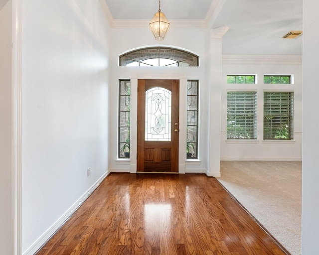18107 Hampton Oak Dr, Spring, TX 77379 - foyer entrance with plenty of natural light, crown molding, and wood finished floors
