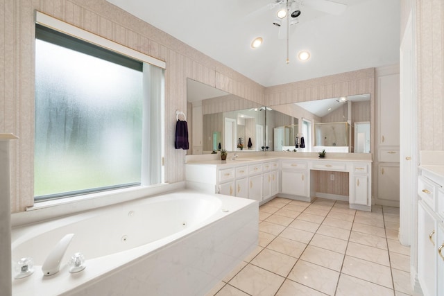 18107 Hampton Oak Dr, Spring, TX 77379 - bathroom featuring double vanity, a whirlpool tub, tile patterned flooring, vaulted ceiling, and wallpapered walls