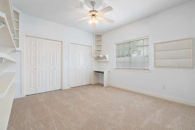 18107 Hampton Oak Dr, Spring, TX 77379 - unfurnished bedroom with carpet, two closets, and a ceiling fan