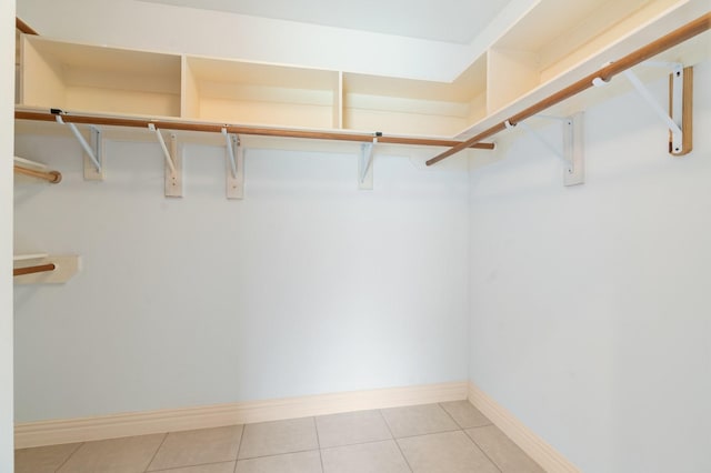 18107 Hampton Oak Dr, Spring, TX 77379 - spacious closet featuring light tile patterned floors