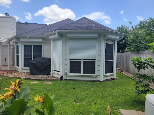 18107 Hampton Oak Dr, Spring, TX 77379 - back of property with a shingled roof and a chimney