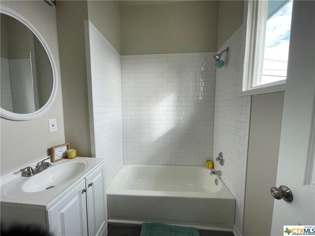 515 Mitchell Ave, Seguin, TX 78155 - bathroom featuring vanity and shower / bathtub combination