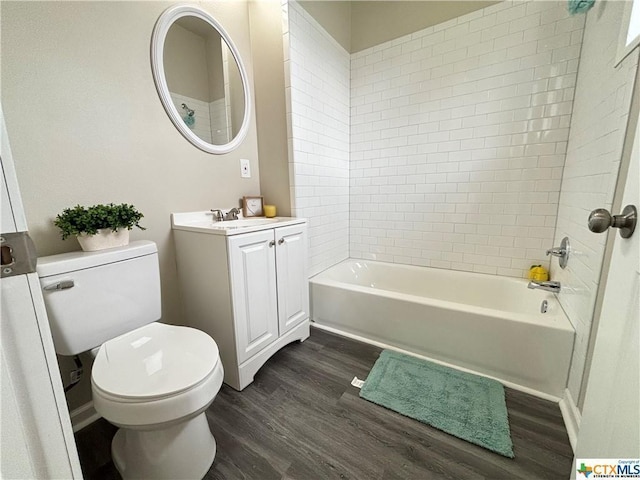 515 Mitchell Ave, Seguin, TX 78155 - bathroom with wood finished floors, vanity, toilet, and shower / bathtub combination