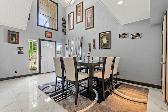 20 Clearview St, Point Blank, TX 77364 - dining room with light marble finish flooring, a textured wall, and baseboards