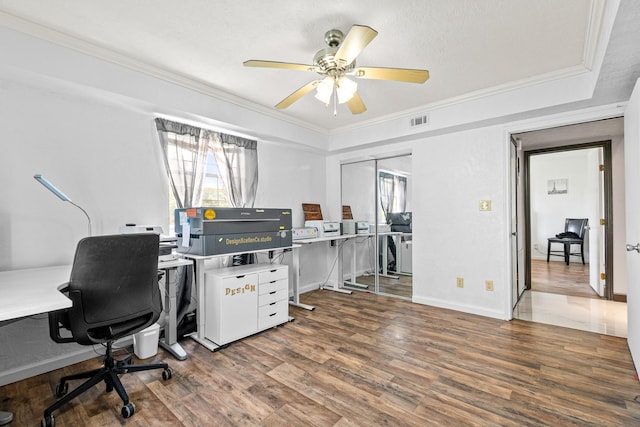 20 Clearview St, Point Blank, TX 77364 - office space featuring wood finished floors, plenty of natural light, ornamental molding, ceiling fan, and baseboards