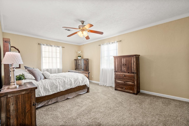 20 Clearview St, Point Blank, TX 77364 - carpeted bedroom featuring ornamental molding, baseboards, ceiling fan, and a textured ceiling