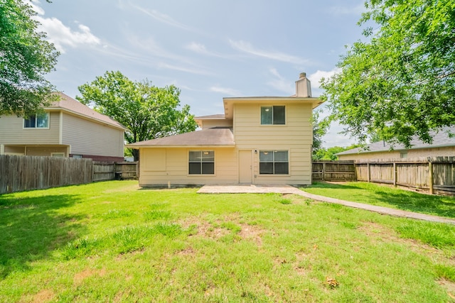 423 N Vista Dr, Houston, TX 77073 - back of property featuring a chimney and a patio