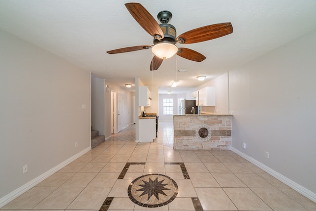 423 N Vista Dr, Houston, TX 77073 - unfurnished living room featuring light tile patterned floors, baseboards, a ceiling fan, and stairway
