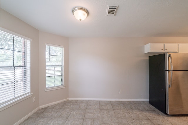 423 N Vista Dr, Houston, TX 77073 - unfurnished dining area featuring baseboards