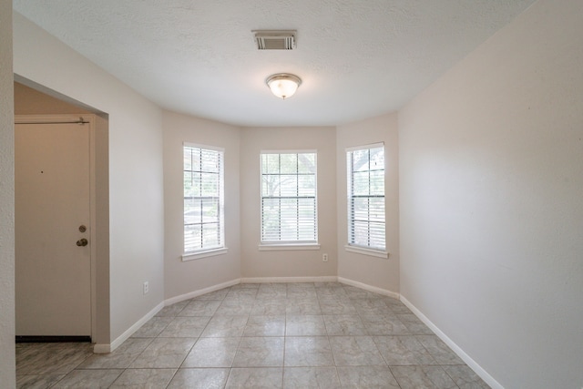 423 N Vista Dr, Houston, TX 77073 - spare room featuring plenty of natural light and baseboards