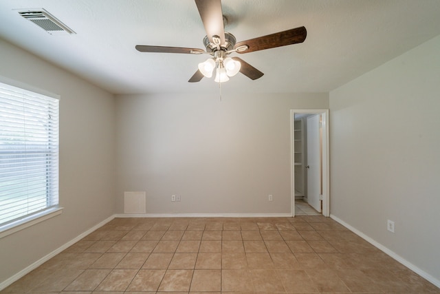 423 N Vista Dr, Houston, TX 77073 - unfurnished room with plenty of natural light, light tile patterned flooring, a ceiling fan, and baseboards