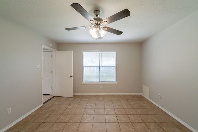 423 N Vista Dr, Houston, TX 77073 - spare room featuring a ceiling fan, light tile patterned floors, and baseboards