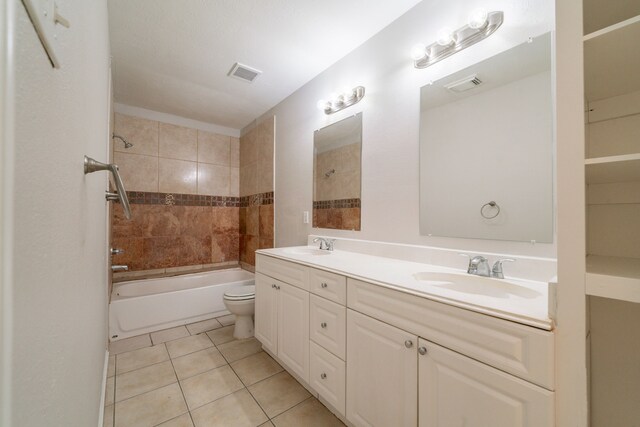 423 N Vista Dr, Houston, TX 77073 - full bath featuring double vanity, tile patterned floors, toilet, and shower / bath combination