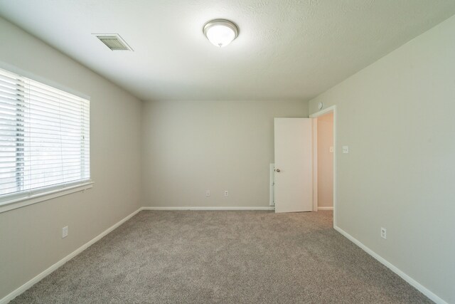 423 N Vista Dr, Houston, TX 77073 - carpeted empty room with baseboards