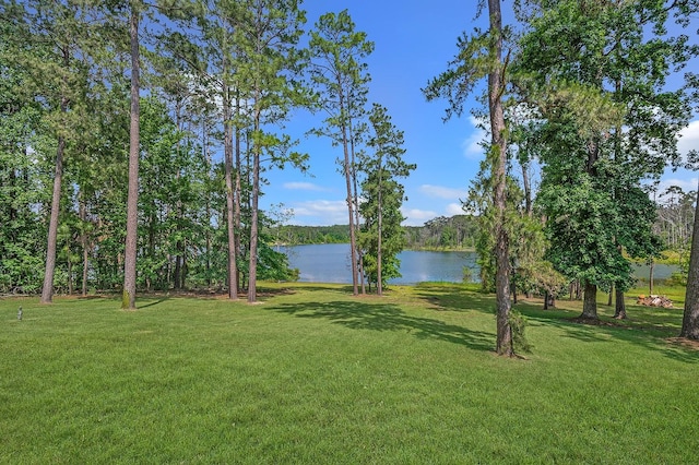 627 Shoreline Dr, Brookeland, TX 75931 - view of green lawn featuring a water view