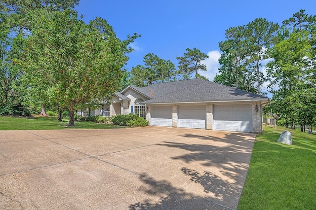627 Shoreline Dr, Brookeland, TX 75931 - view of front of property with brick siding, a front yard, a garage, roof with shingles, and driveway