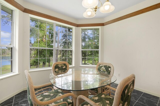 627 Shoreline Dr, Brookeland, TX 75931 - dining room with a chandelier and baseboards