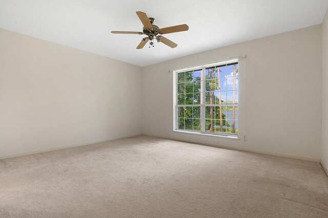 627 Shoreline Dr, Brookeland, TX 75931 - unfurnished room with carpet, ceiling fan, and baseboards