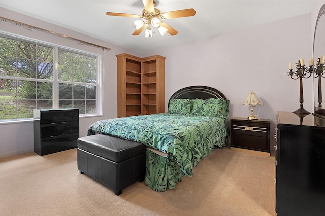 627 Shoreline Dr, Brookeland, TX 75931 - bedroom featuring light carpet, a ceiling fan, and baseboards