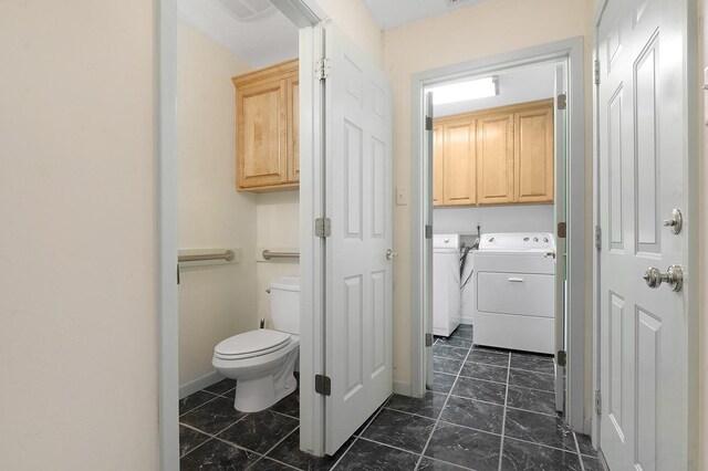 627 Shoreline Dr, Brookeland, TX 75931 - bathroom with toilet and washing machine and clothes dryer
