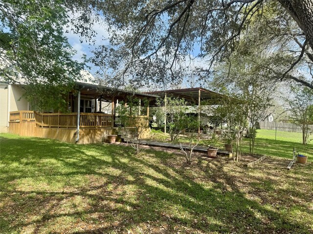 706 W St, Yoakum, TX 77995 - view of green lawn featuring a deck